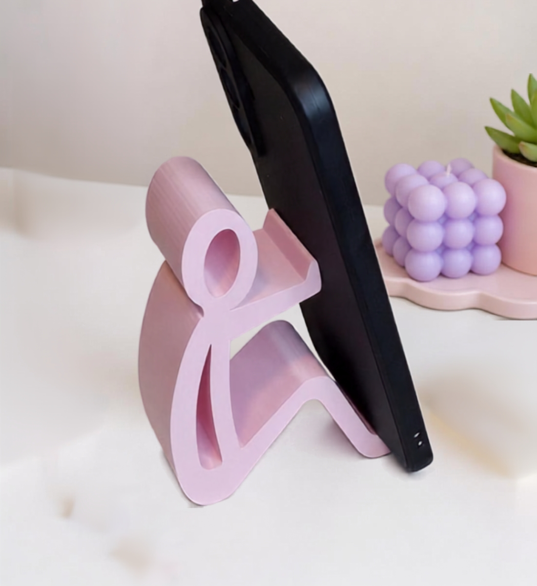Het Zittend Mannetje – Telefoonhouder – Roze